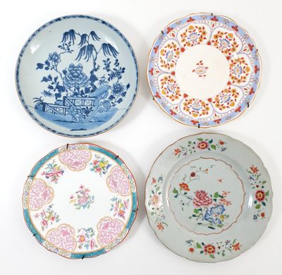 four plates with different designs on them on a white surface