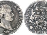 a close up of a silver coin with a picture of a man on it