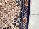 a rug on the floor with a cat laying on it