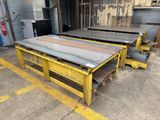 two yellow pallets are stacked on top of each other in a warehouse