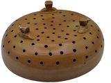 a small wooden object with holes on it