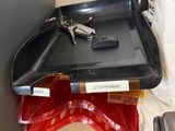 a black tray with a gun on top of it