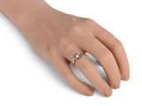 an image of a woman ' s hand with a ring on it