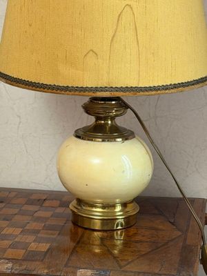a lamp that is on top of a wooden table