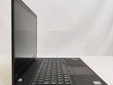 a black laptop with a red button on the keyboard