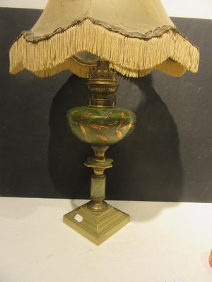 a lamp that is sitting on a table with a lamp shade on it