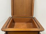 a small wooden table with a wooden box on top of it