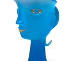 a blue vase that has a face on it