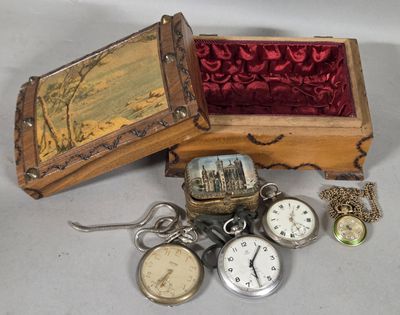 many different types of pocket watches in this box