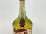 a green bottle with a picture of a castle on it