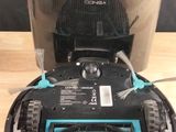 a small robot that is sitting on a wooden table