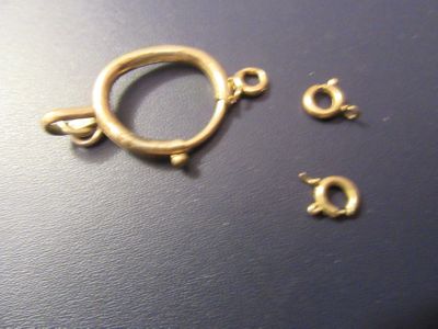 three pieces of metal that have been placed on a table