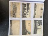 an old photo of a bunch of old photos on a table