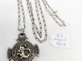 silver necklace with a cross and a firefighter ' s emblem on it