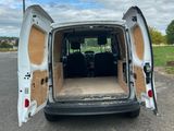 the back of a white van with the door open