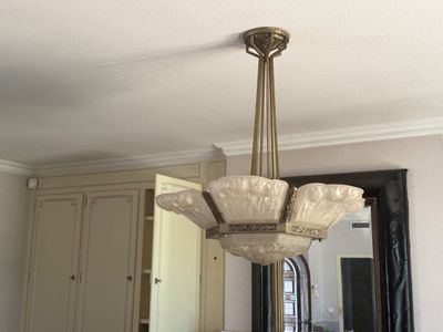 a chandelier hanging from the ceiling in a kitchen