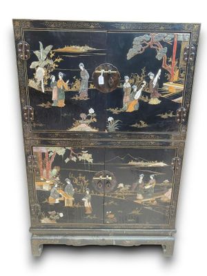 an image of a black cabinet with oriental scenes on it