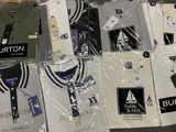 a lot of t - shirts that are wrapped in plastic