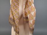 a close up of a mannequin torso with a scarf on it