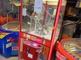 several arcade machines in a room with a lot of toys