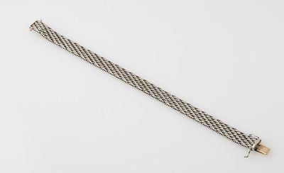 a close up of a metal bracelet with a clasp on it