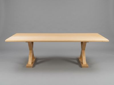 a close up of a wooden table on a grey background