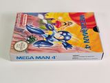 the box for the game mega man 4 is sitting on a white surface