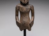an image of a statue of a woman with a hat on her head