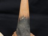 two clay cones that are next to each other on a black background