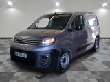 citroen van parked in a room with checkered flooring