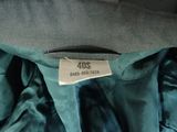 an image of a blue jacket with a label on it