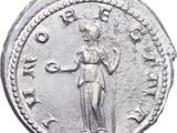 a close up of a coin with a woman on it