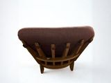 a chair that is made of wood and has a brown seat