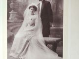 an old photo of a bride and groom posing for a picture