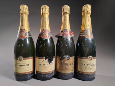 quatre bouteilles de champagne sont alignées