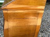 an old wooden desk with a mirror on top of it