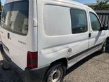 a white van that is parked in a lot