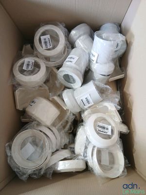 many rolls of toilet paper in a cardboard box