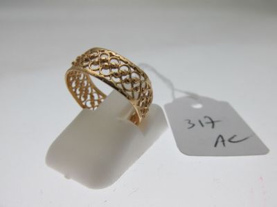 a close up of a ring on a white surface with a price tag