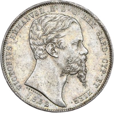 une pièce d'argent à l'effigie d'un homme barbu