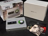 a white box with a black and white picture of a cassette player and a cd
