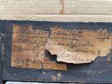 a piece of paper on top of a wooden box
