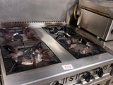 stainless steel stove top with two burners and a toaster oven