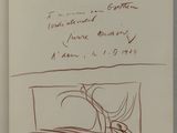 an open book with a drawing of a person laying on a bed