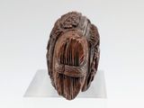 a sculpture of a man with a beard on a white surface