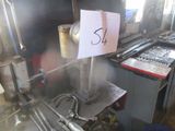 a picture of a machine that has a sign on it