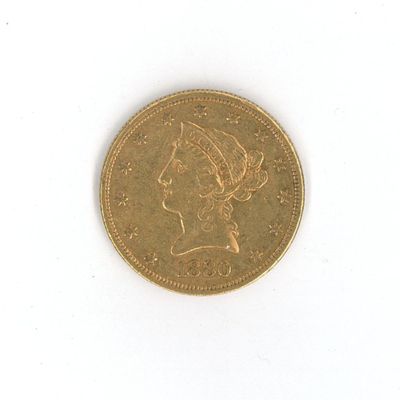 a gold coin with a woman ' s head on it