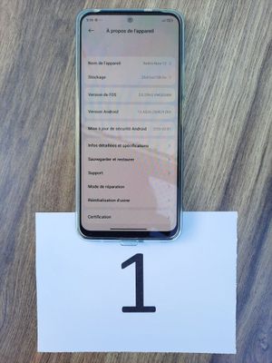 an iphone is sitting on top of a table with a number 1 on it