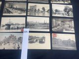 a lot of old postcards on display on a table