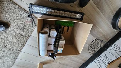 a box that has some items in it on the floor